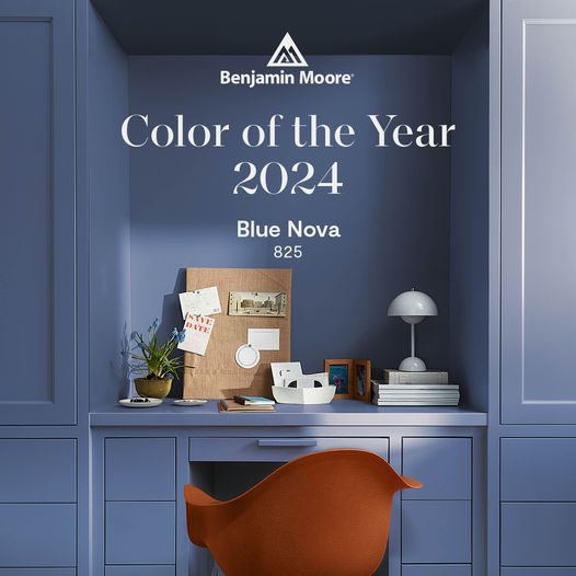 Benjamin Moore Nova Blue color of the year painted on walls and cabinets of a built in desk nook.